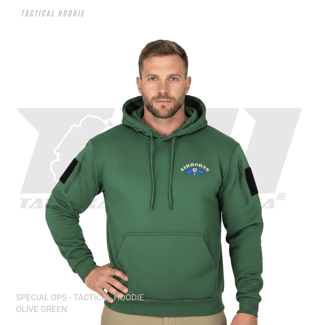 Man wearing olive green tactical hoodie with kangaroo pockets and adjustable drawstring hood