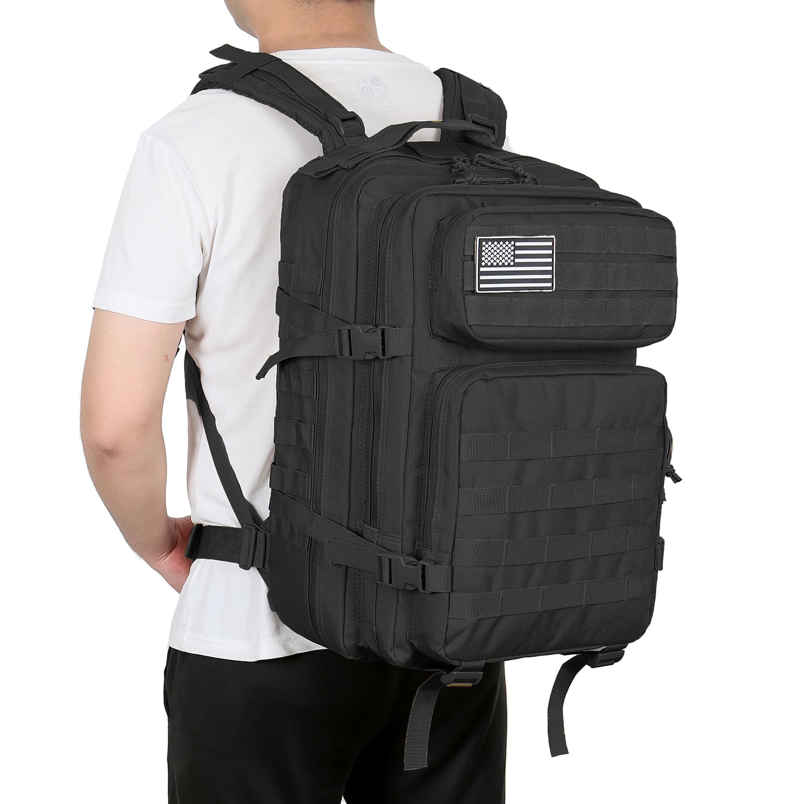 Tactical assault pack with MOLLE system loaded with survival gear and outdoor equipment